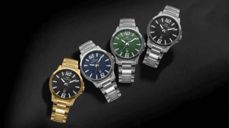 Relógio Technos masculino original com pulseira de aço, mostrador azul e detalhes em laranja, apresentado em sua caixa oficial de fábrica.